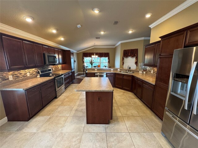 kitchen featuring visible vents, appliances with stainless steel finishes, ornamental molding, vaulted ceiling, and a sink