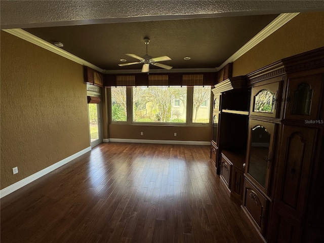 unfurnished living room with baseboards, a textured wall, dark wood-type flooring, and crown molding