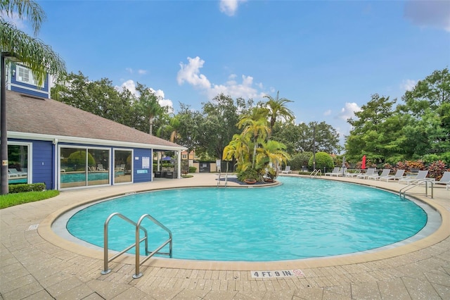 view of pool featuring a patio