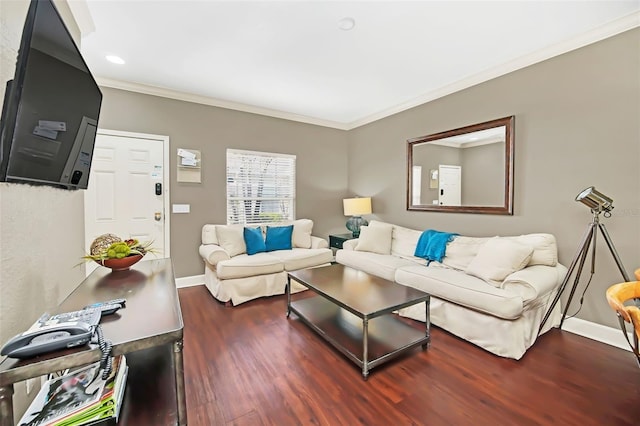 living room featuring dark hardwood / wood-style flooring and ornamental molding