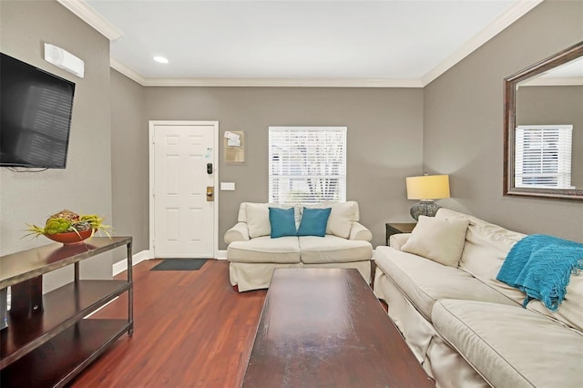 living room with crown molding and dark hardwood / wood-style flooring