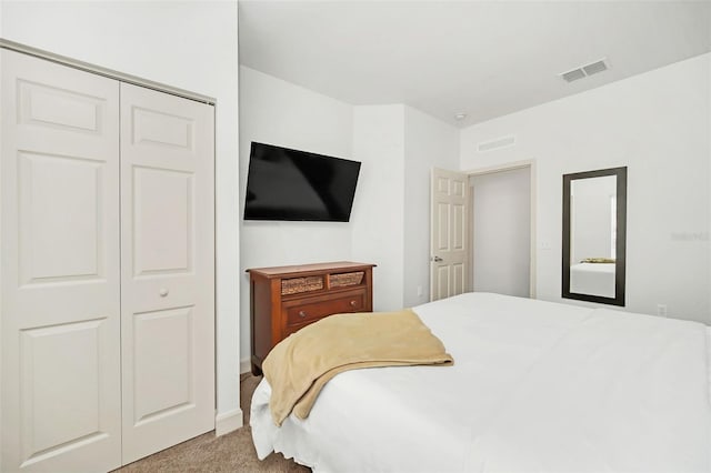 carpeted bedroom featuring a closet