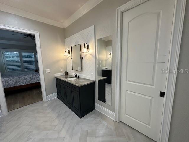 bathroom with vanity, ceiling fan, parquet floors, and crown molding