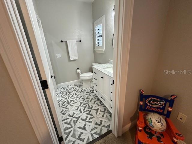 bathroom with vanity and toilet