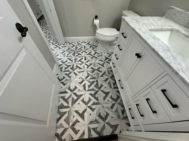 bathroom with vanity and toilet