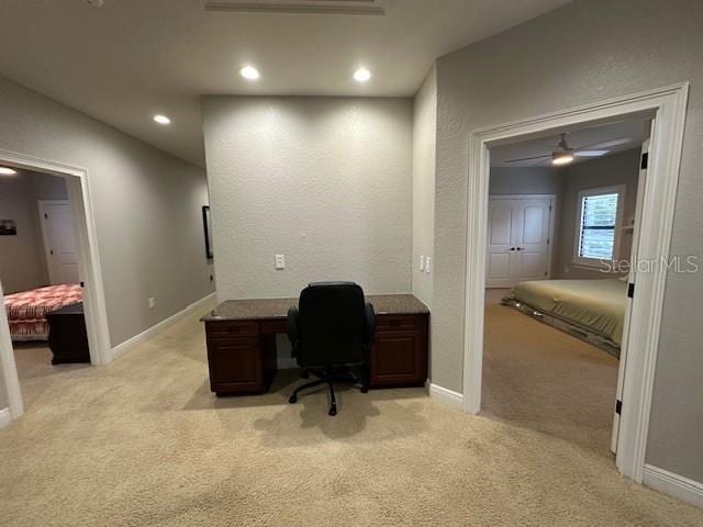 office area with ceiling fan and light colored carpet