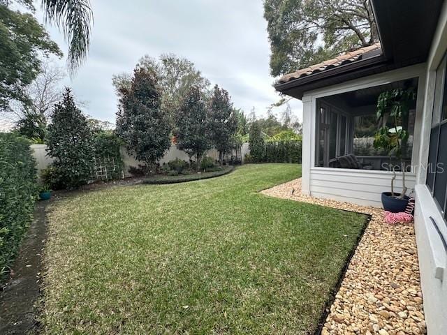 view of yard featuring a sunroom