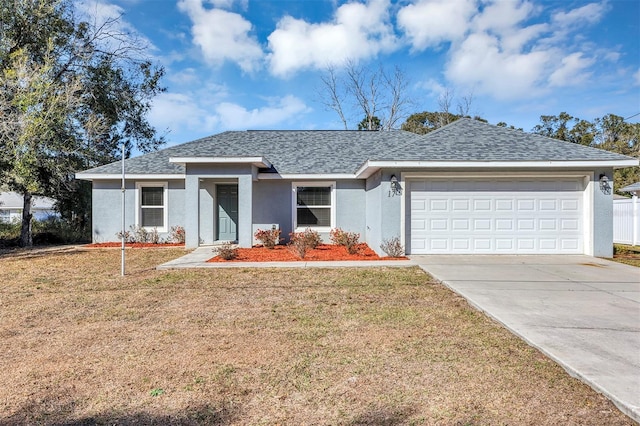 ranch-style home featuring a front yard and a garage