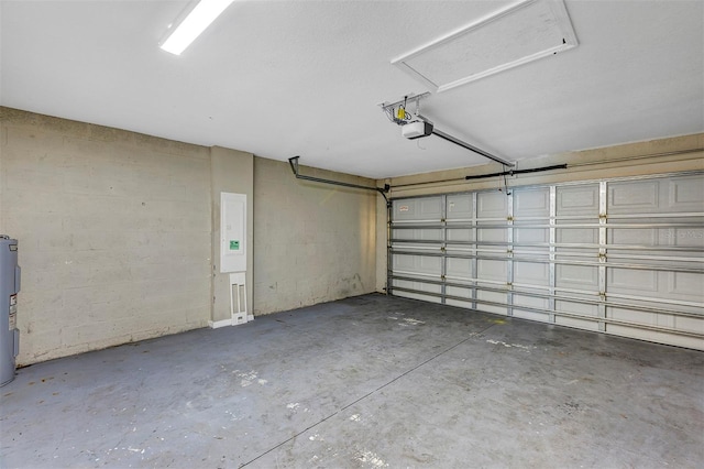 garage featuring electric panel, electric water heater, and a garage door opener