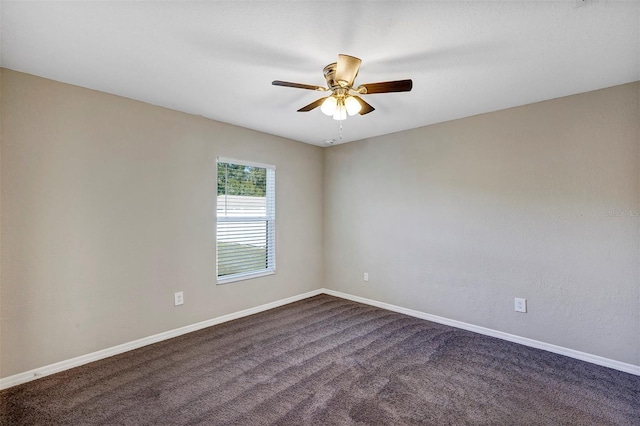 spare room featuring carpet flooring and ceiling fan