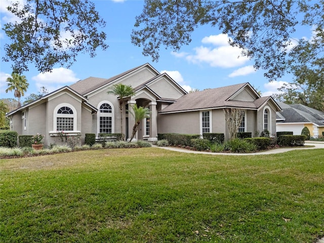 ranch-style house with a front lawn