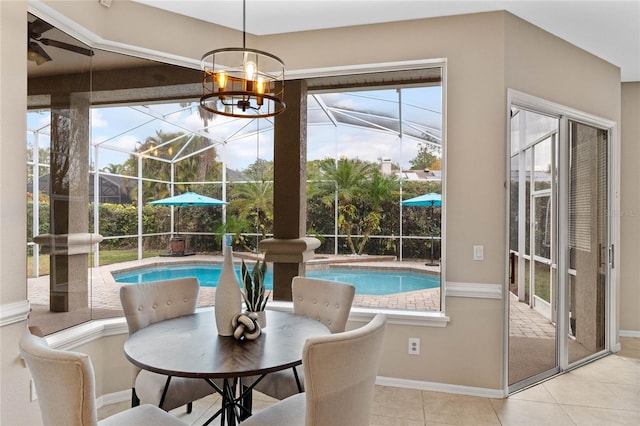 dining room with ceiling fan and light tile patterned floors