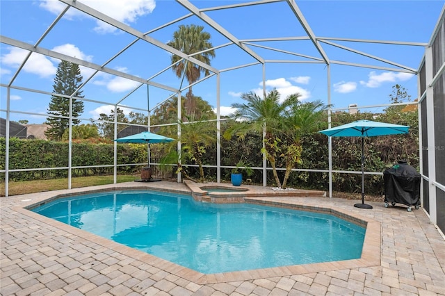 view of pool featuring a patio, an in ground hot tub, glass enclosure, and area for grilling