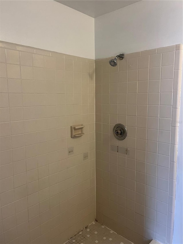 full bathroom with a tile shower