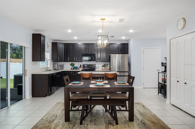 dining room with sink and light tile patterned flooring