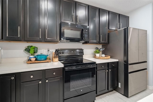 kitchen with light tile patterned floors and black appliances