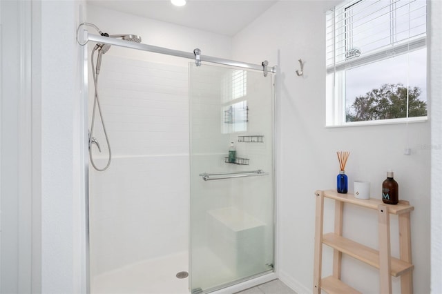 bathroom with a shower with shower door