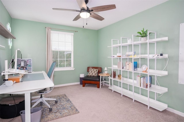 carpeted home office with ceiling fan