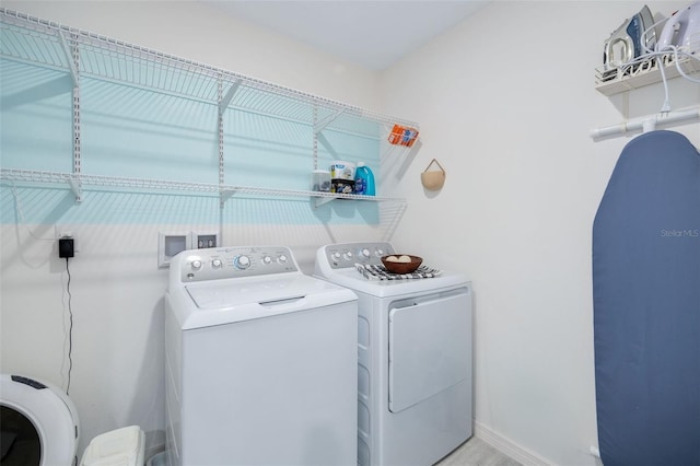 washroom with washer and clothes dryer