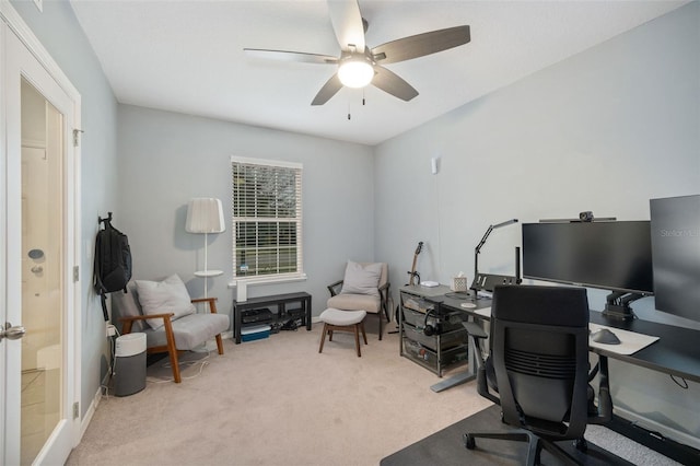 office with light carpet and ceiling fan