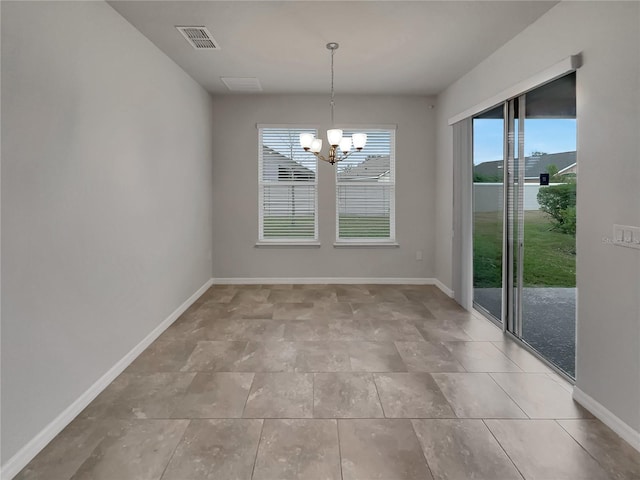 unfurnished dining area with a notable chandelier