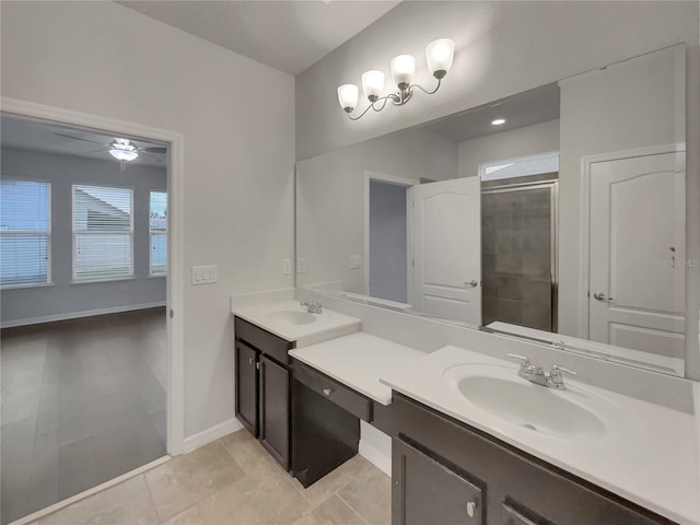 bathroom with tile patterned flooring, ceiling fan, an enclosed shower, and vanity