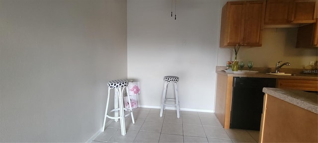 kitchen with light tile patterned flooring