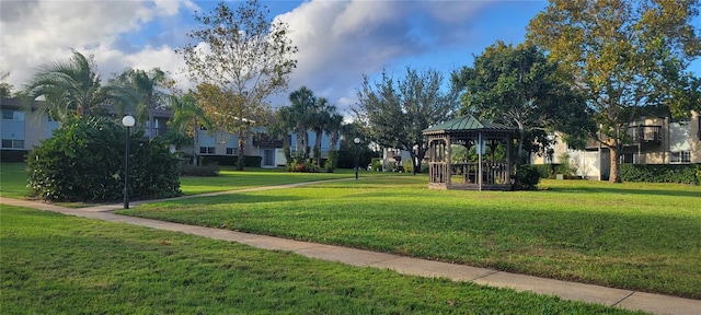 view of home's community featuring a lawn and a gazebo