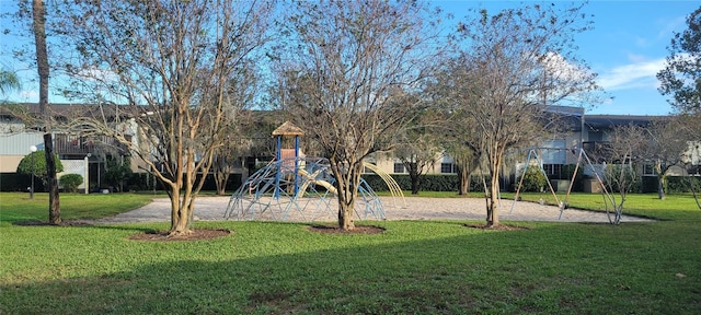 view of playground with a lawn