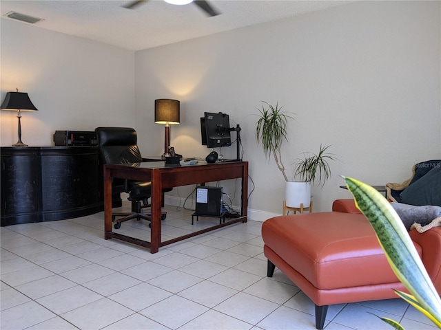 office space with light tile patterned floors and ceiling fan