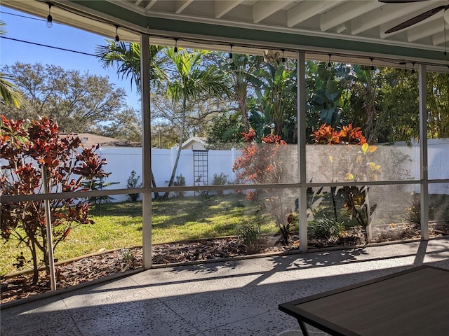 sunroom / solarium featuring ceiling fan and a wealth of natural light