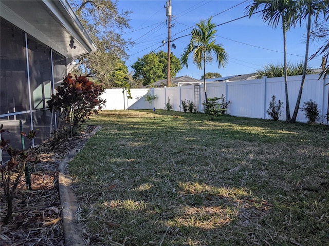 view of yard featuring a sunroom