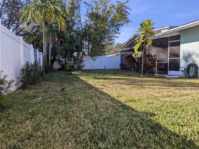 view of yard featuring a sunroom