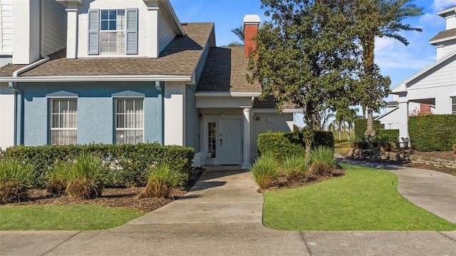 view of front of house featuring a front lawn