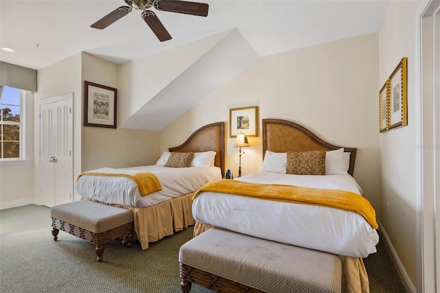 carpeted bedroom featuring vaulted ceiling and ceiling fan