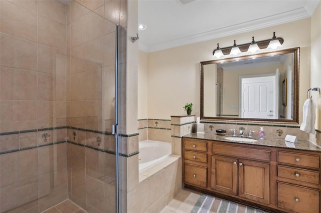 bathroom featuring ornamental molding, separate shower and tub, and vanity