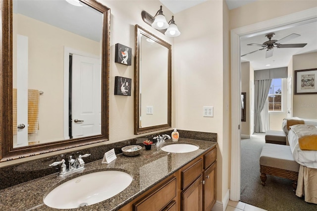 bathroom with ceiling fan and vanity