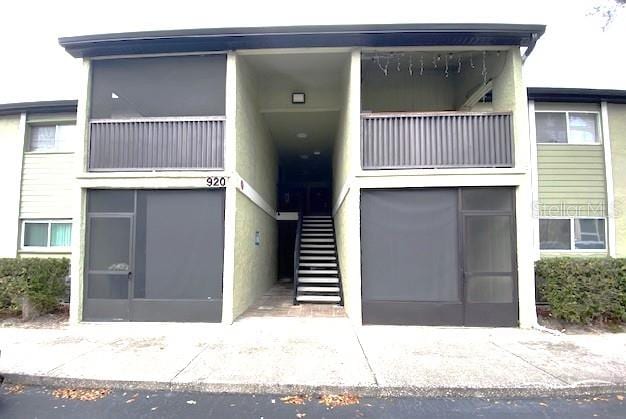 view of front of property with a balcony