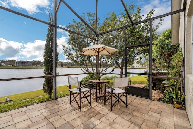 unfurnished sunroom with a water view