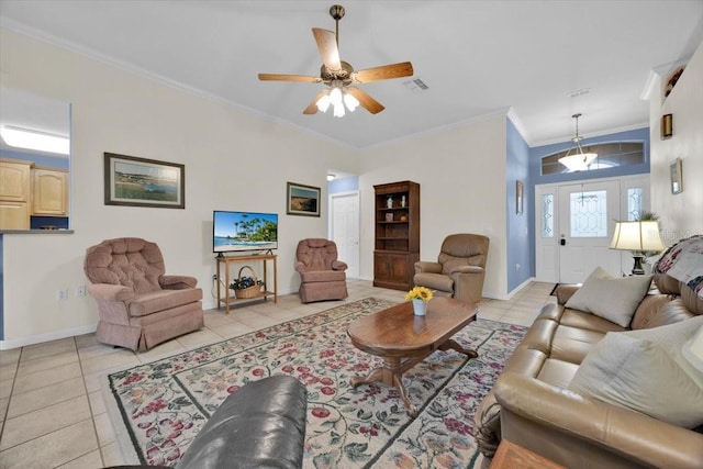 living room with ceiling fan, ornamental molding, and light tile patterned floors