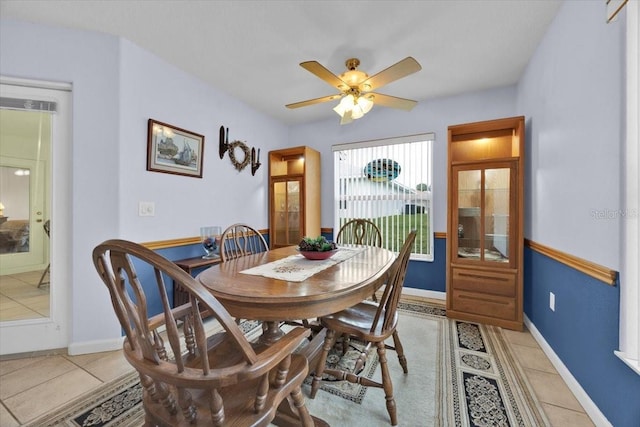 dining room with ceiling fan and light tile patterned floors