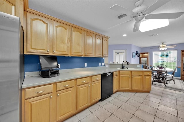 kitchen featuring kitchen peninsula, light tile patterned floors, stainless steel refrigerator, ceiling fan, and black dishwasher