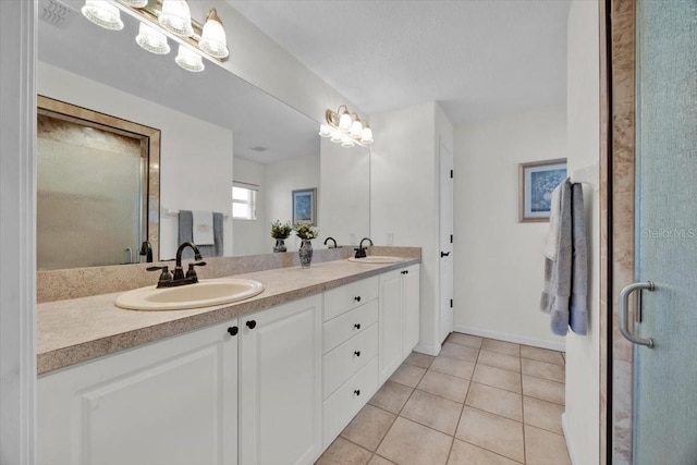 bathroom featuring tile patterned flooring and vanity