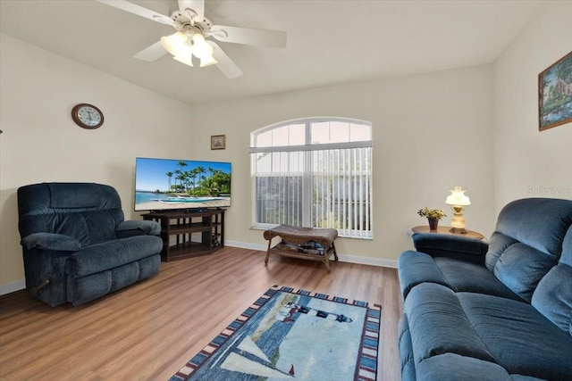 living room with ceiling fan and wood-type flooring