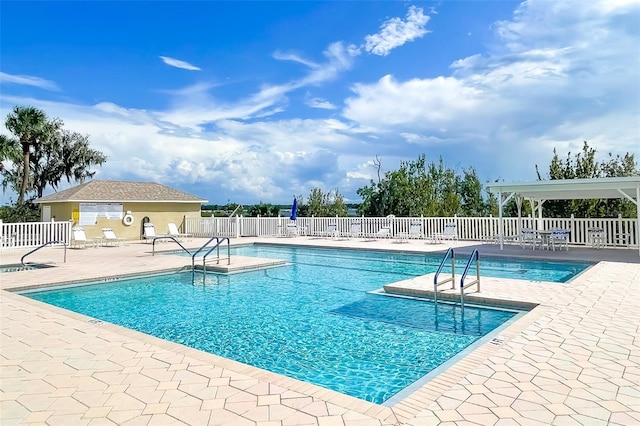 view of swimming pool with a patio area