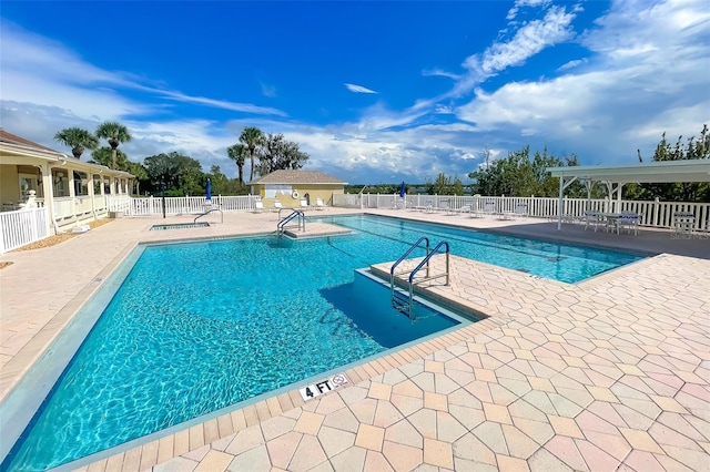 view of swimming pool featuring a patio area