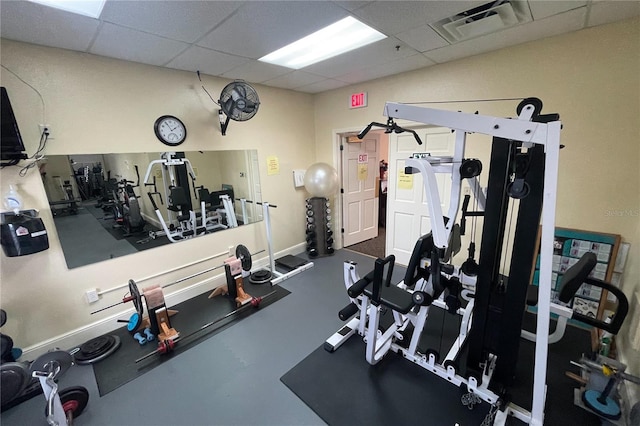 workout area with a paneled ceiling