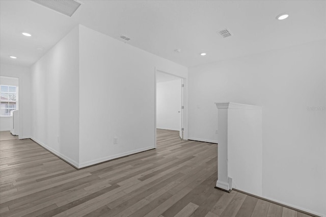 unfurnished room with light wood-type flooring