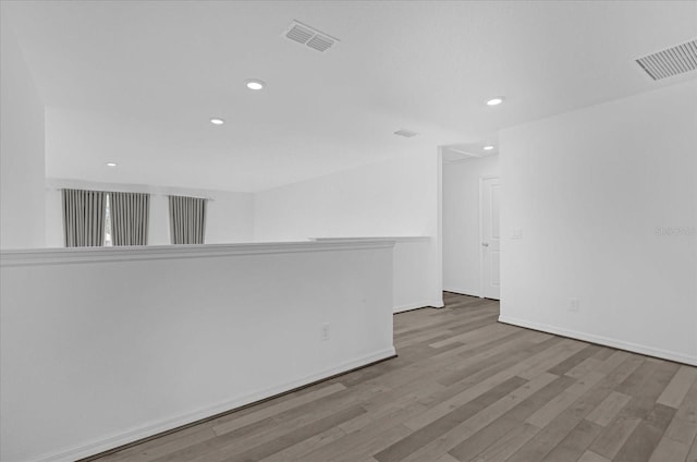 empty room with hardwood / wood-style floors