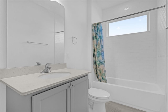 full bathroom featuring shower / bath combo, toilet, and vanity